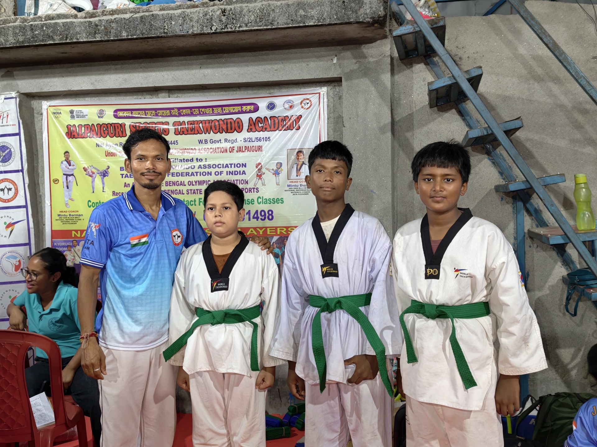 Head Coach with green-belt students