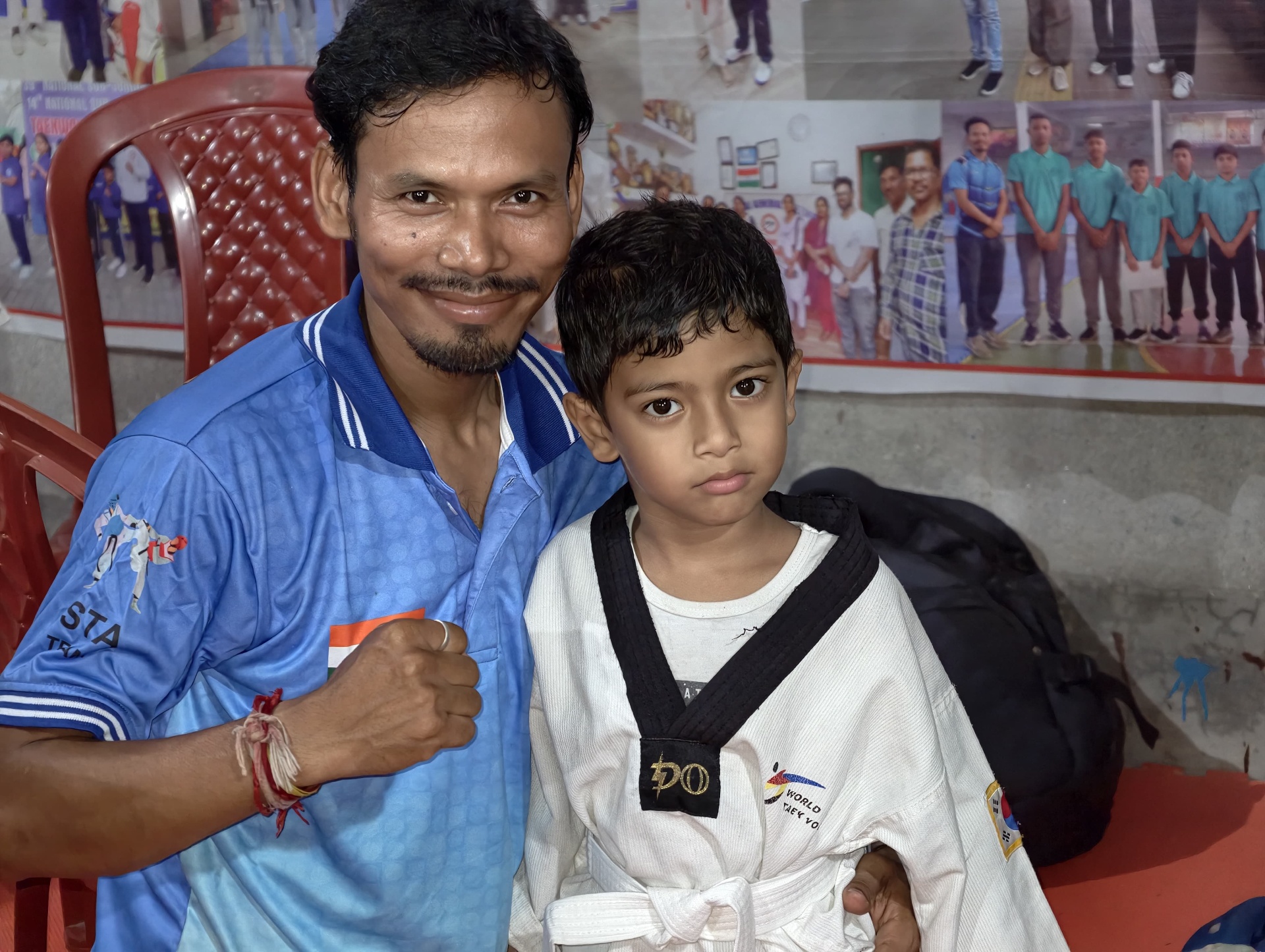 Coach with a young black-belt trainee