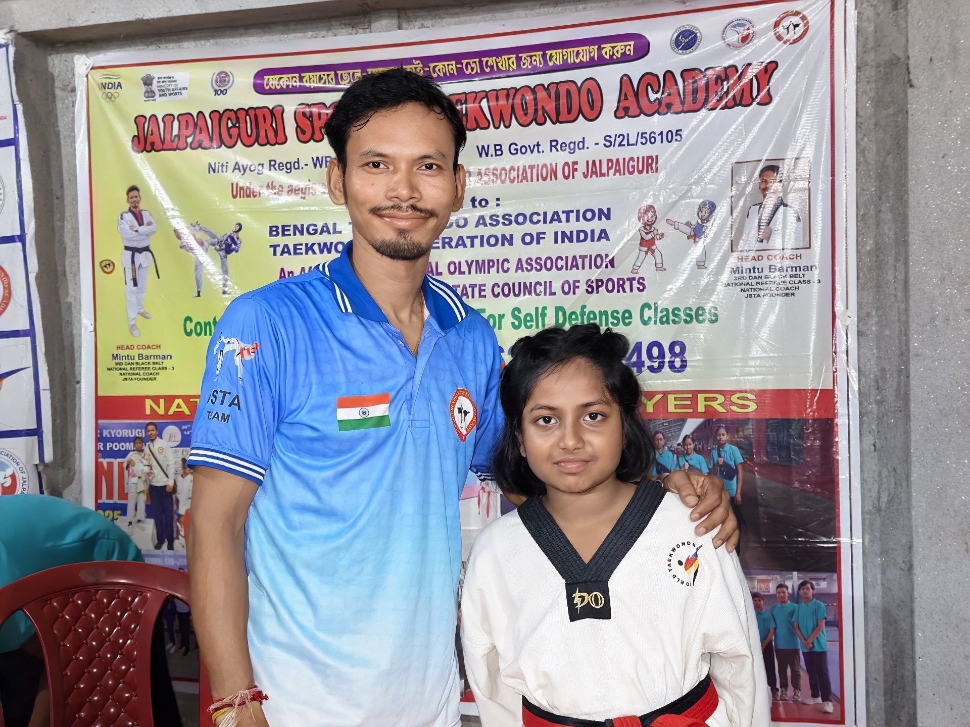 Coach with a black-belt student